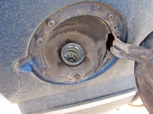 Clean the area around the fuel tank cap