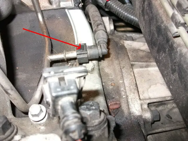 Locate the fuel rail on the fuel injector