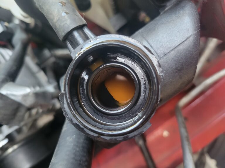 Oil in Coolant Reservoir Signs, Causes, and Fixes